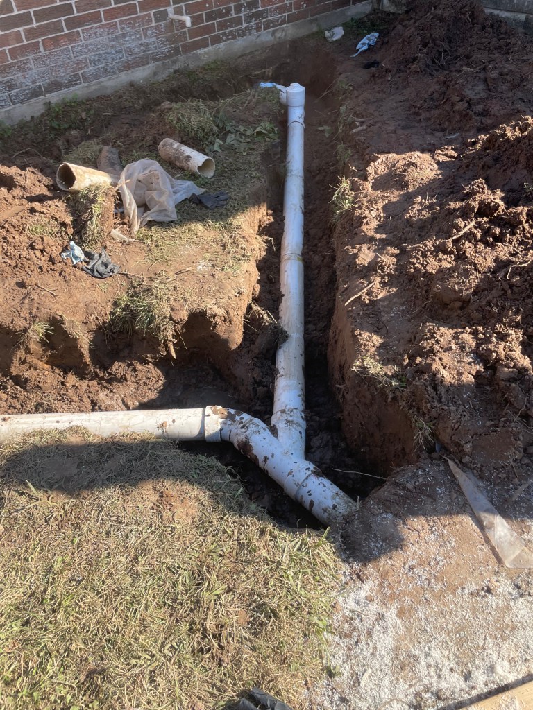 Sewer line repair in Tomball showing plumbing excavation and repair to restore proper drainage and prevent backups.
