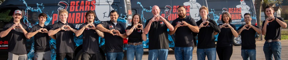 The Bear's Plumbing team standing proudly in front of their service vehicles, serving homeowners throughout Spring, Texas with professional plumbing services.