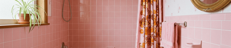 Retro pink bathroom with bathtub, sink, and toilet